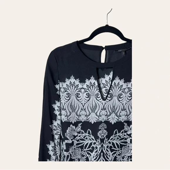 0755. BCBGMAXAZRIA LONG SLEEVE BLOUSE SIZE SMALL BLACK AND WHITE IN COLOR FLORAL - Picture 2 of 9